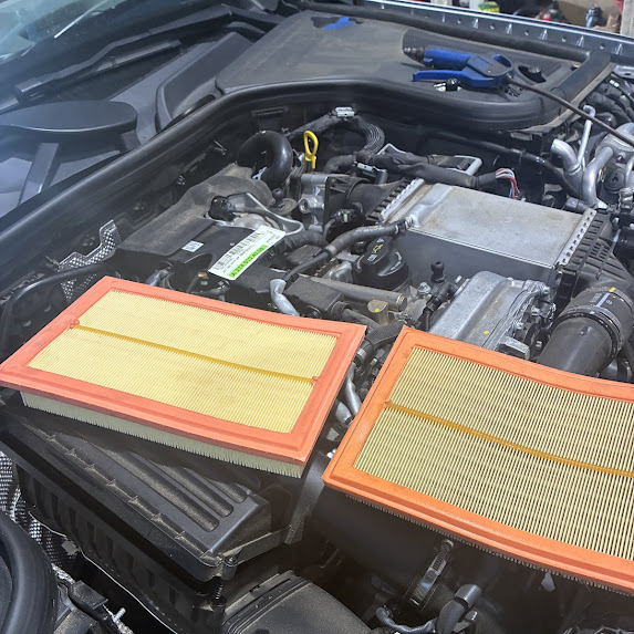 Engine air filters resting on a Mercedes-Benz engine bay